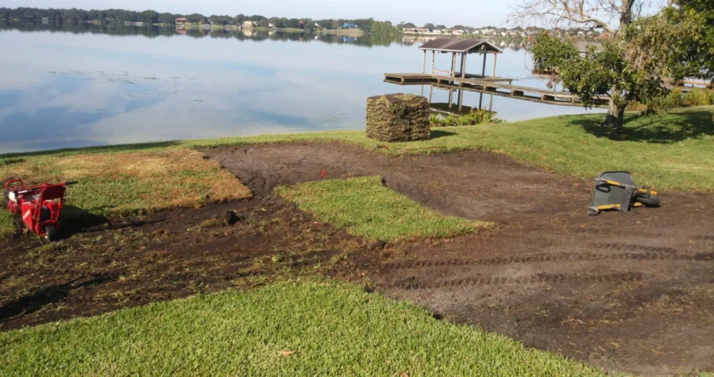 Lawn preparation near a lake.