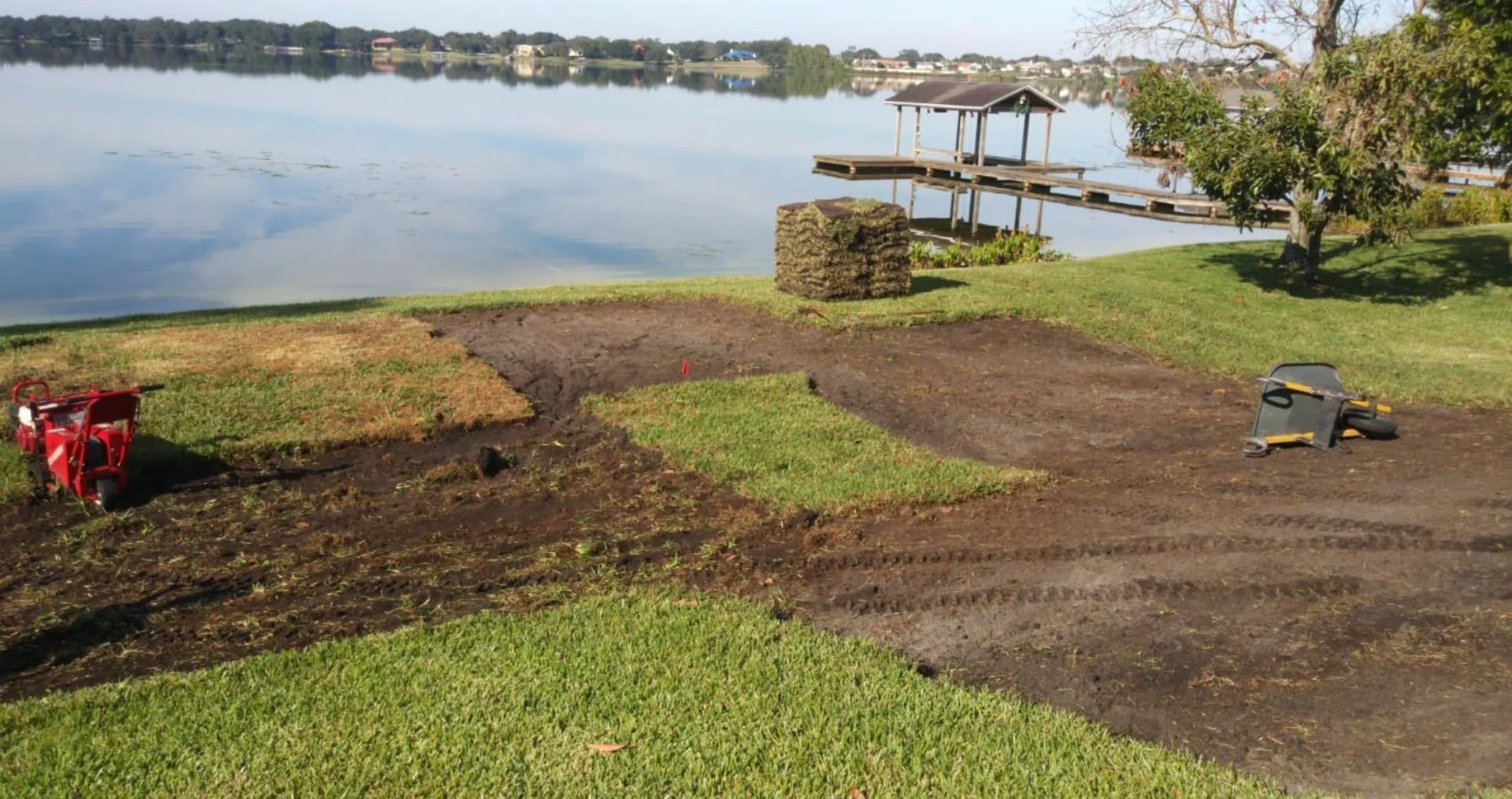 Lawn preparation near a lake.