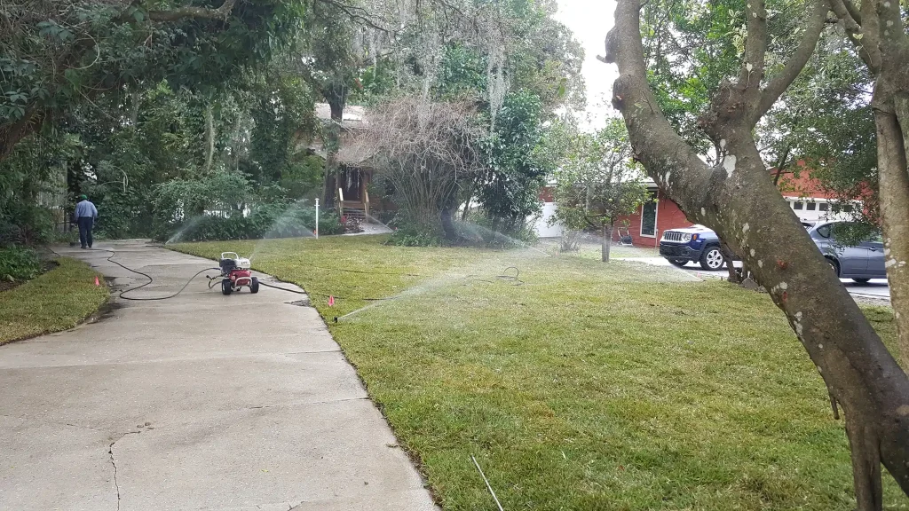 Lawn being watered with sprinkler system